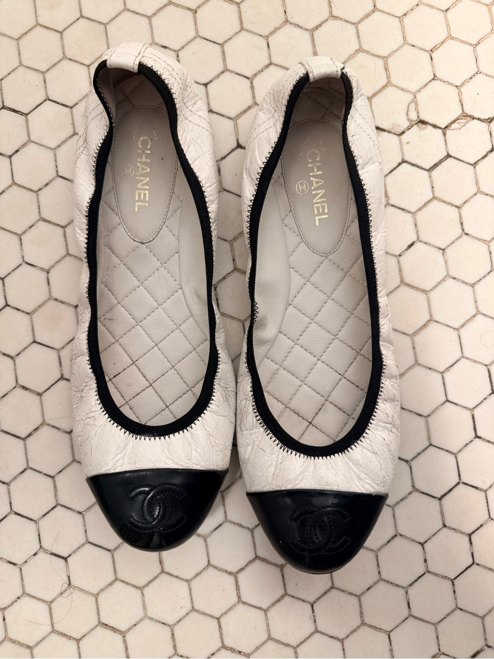 CHANEL White Quilted Leather Ballet Flats with Black Cap Toe and CC Logo
